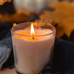 Lit fall candle